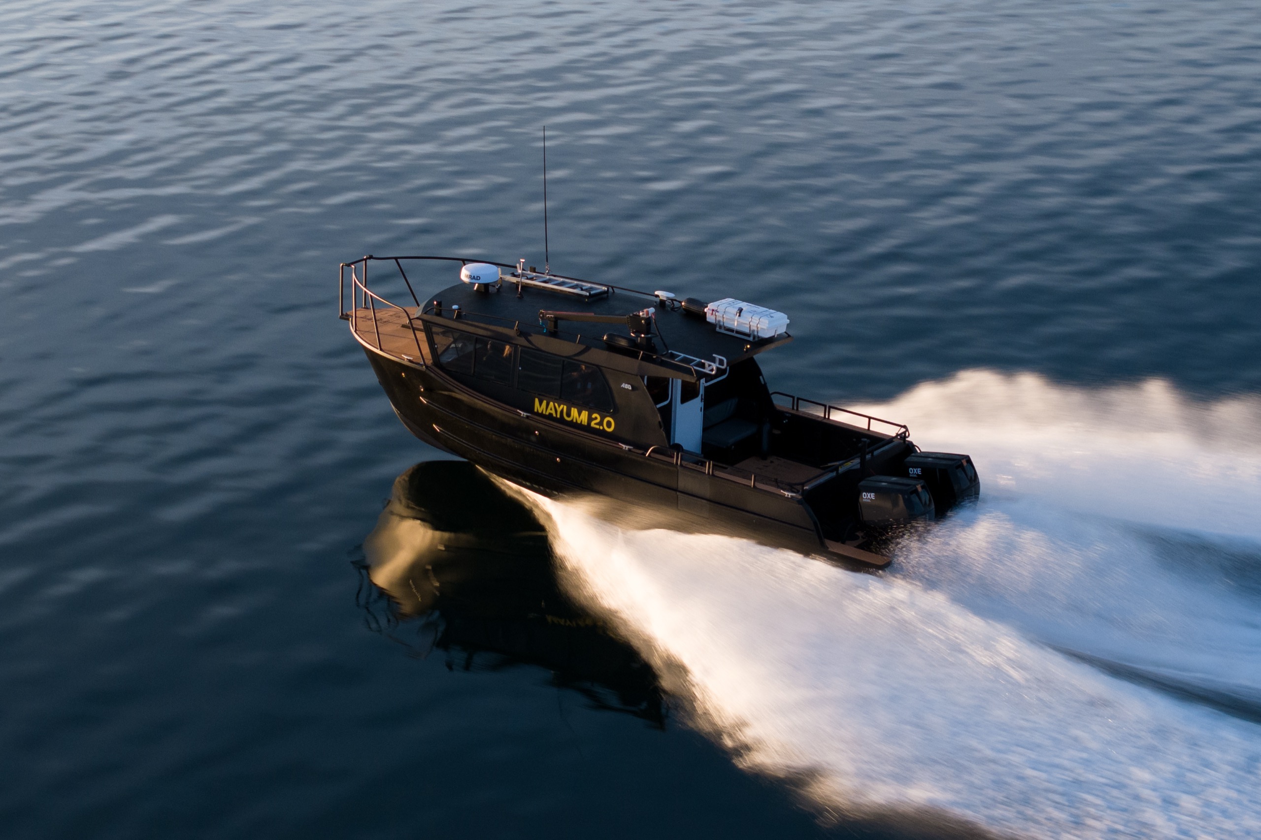 Sea Wolf expedition vessel at golden hour on Northern Vancouver Island coastal waters, all-inclusive lodge package BC