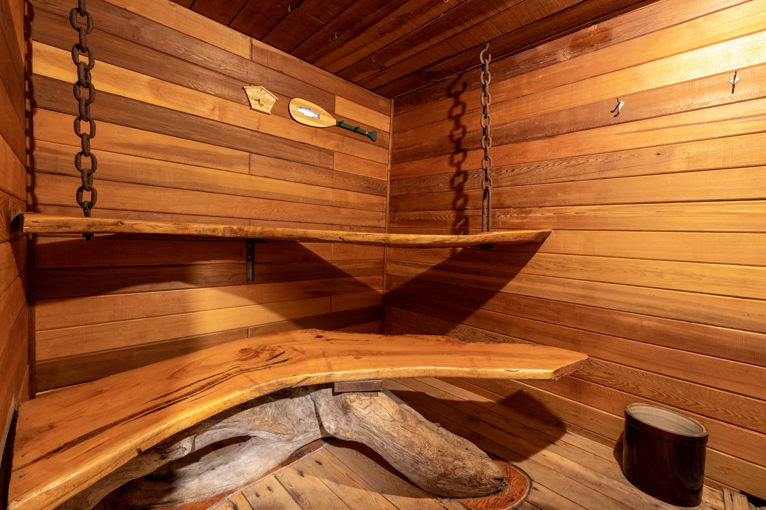 Cedar sauna with live-edge benches at Sea Wolf Lodge